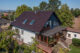 Einfamilienhaus mit Flachdachziegel J11v in maronenbraun