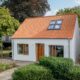 Einfamilienhaus mit Satteldach, Hohlpfanne H1 in naturrot gedeckt