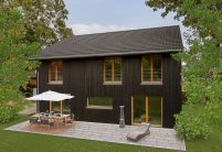 Dunkles Holzhaus mit Doppelmuldenfalzziegel Z2 in nachtgrau gedämpft