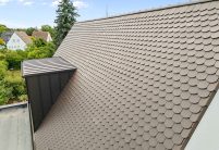 Referenz zum inspirieren mit dunkelbraunen Biberschwanzziegeln in dunkelbraun